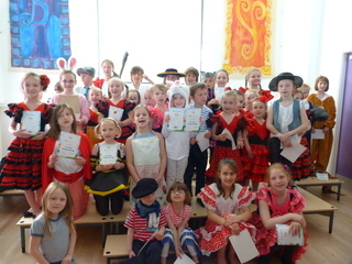 Children receiving certificates in an LCF Spanish school club